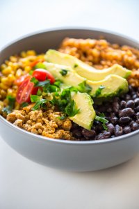 Turkey Taco Bowls with Cauliflower Rice is a healthy low-carb meal that is quick and easy to prepare and makes great leftovers! #turkey #groundturkey #blackbeans #cauliflowerrice #cauliflower #lowcarb #wholefoods #healthyrecipe #cleaneating