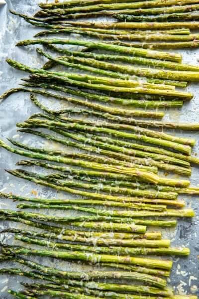 Fresh asparagus drizzled with olive oil and garlic and roasted with fresh parmesan cheese is a healthy and easy vegetable to accompany your favorite entree!