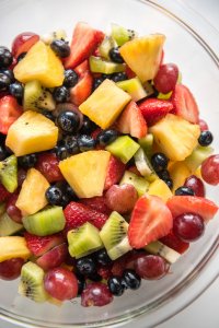 This honey lime fruit salad is the perfect bowl of freshness! Perfect for a party, or just for meal prep for lunch or dinner! #honeylime #fruitsalad #kiwi #blueberries #strawberries #pineapple #mealprep #summerbbq #potluck #salad